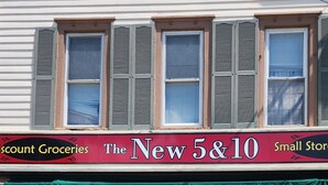 A storefront with a sign reading "The New 5&10 Small Store" and a large number "72" on the door. - BRAND NEW! 1-bedroom apartment in the beautiful historic village of Greene, NY (Greene)