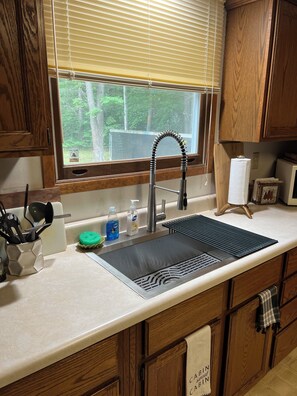 Fridge, microwave, oven, stovetop - Camp18, peaceful cabin in the woods, trail access, come ride in Leota. (Harrison)