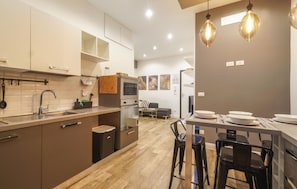 Fridge, stovetop, dishwasher, coffee/tea maker