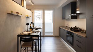 Luxury Apartment, 1 Bedroom, Non Smoking, Courtyard View | Private kitchen | Full-size fridge, microwave, oven, stovetop - Urban Chic Luxury Suite Apartments (Rome)