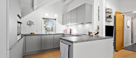 Fridge, stovetop, dishwasher, coffee/tea maker