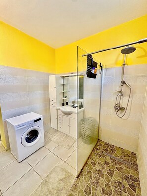 Shower, hair dryer, towels, soap