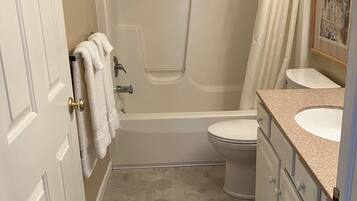 Shower, jetted tub, hair dryer, towels