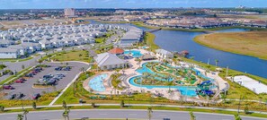 A residential area with a large swimming pool and a marina. - Storey Lake Family DISNEY/UNIVERSAL EPIC UNIVERSE home w/ POOL and Lake View (Kissimmee)