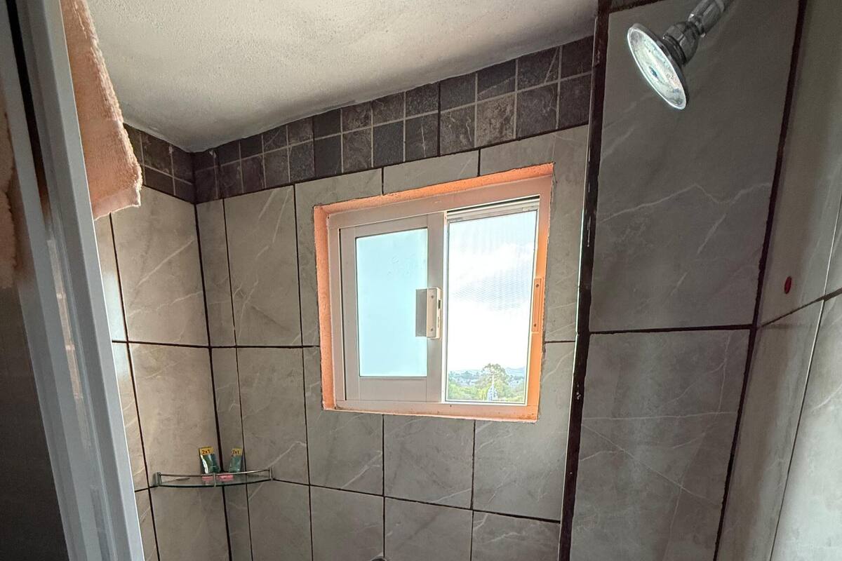 Basic Single Room, Patio | Bathroom | Shower, towels, soap, shampoo
