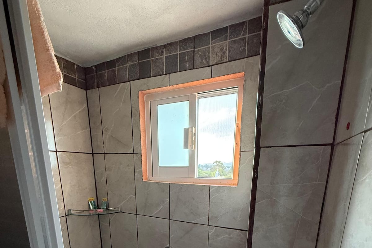Basic Single Room, Patio | Bathroom | Shower, towels, soap, shampoo