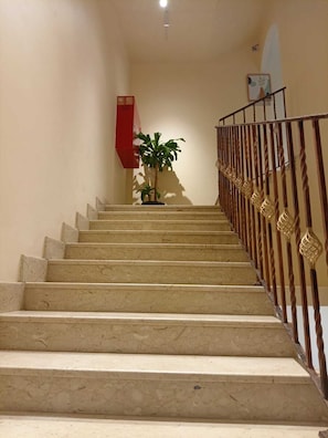 Interior - Private room 8m for men. Bed, AC, side table, Wi-Fi. Shared baths, lounges. (Buraydah)