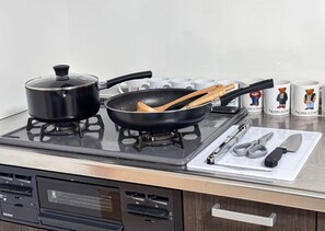 Fridge, microwave, stovetop, cookware/dishes/utensils