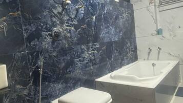 Luxury Room | Bathroom | Shower, rainfall showerhead, designer toiletries, towels