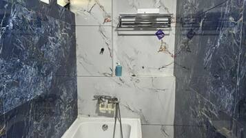Luxury Room | Bathroom | Shower, rainfall showerhead, designer toiletries, towels