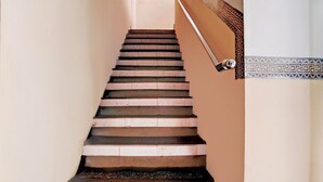A staircase with alternating dark and light steps, leading upwards. - Hotel O Tegalsari Near Tunjungan Plaza (Surabaya)