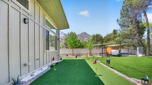 A well-maintained artificial green lawn with a pool table and a barbecue area. - Waterfront,  family resort, 2 separate units, Sauna, and Jacuzzi/ sleeps 8 (Kernville)