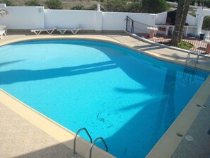 Relax by the pool surrounded by a serene atmosphere and comfortable lounge chairs.