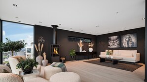 Una sala de estar moderna con chimenea, un sofá y una mesa de centro.