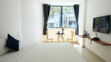 Minibar, desk, laptop workspace, blackout curtains