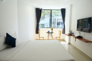 Deluxe Double Room, 1 Queen Bed, City View | Minibar, desk, laptop workspace, blackout curtains - TalaSaigon Hotel (Ho Chi Minh City)