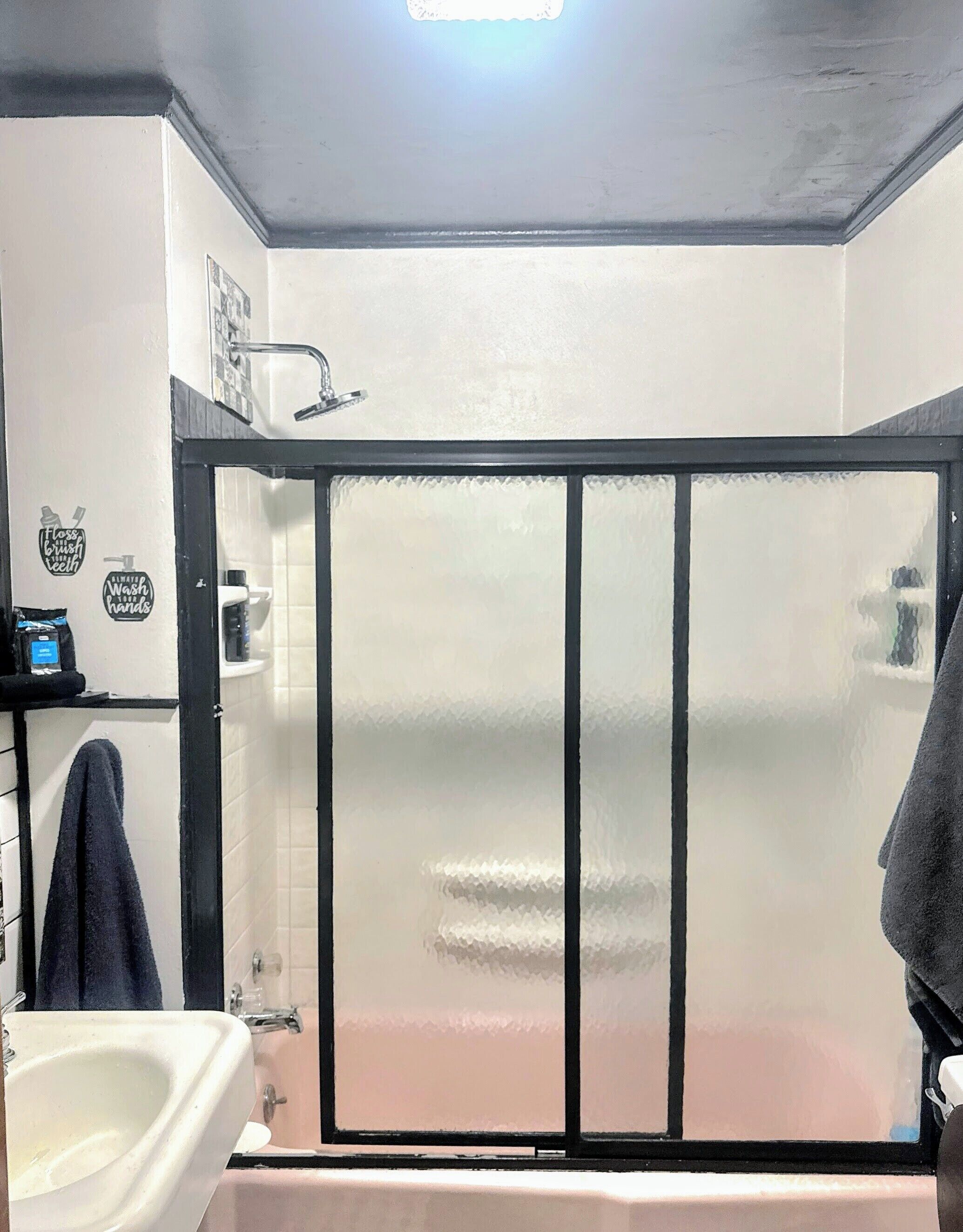 Combined shower/tub, rainfall showerhead, towels, soap