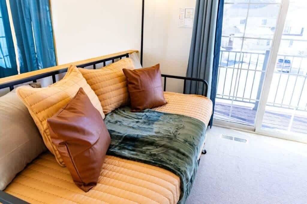 Trundle bed is equipped to sleep two in a variety of ways
