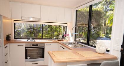 Nestled in Nunderi, this loft style tiny home offers a special retreat for two!
