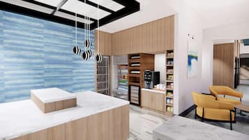 A modern reception area with a marble counter, wooden cabinets, a vending machine, and a yellow armchair.