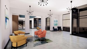 A modern lobby with a seating area, a staircase, and a large window with a view. - Hilton Garden Inn Dayton Downtown (Dayton)