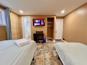 Deluxe Room, 1 Queen Bed, Private Bathroom | 1 bedroom, desk, laptop workspace, blackout curtains