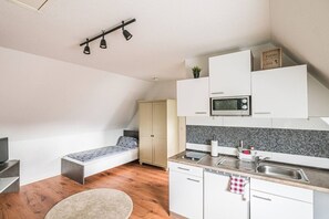 Fridge, microwave, stovetop, coffee/tea maker