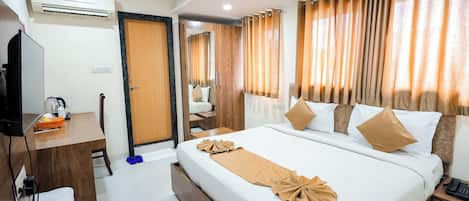 Desk, laptop workspace, free WiFi, bed sheets