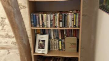 A bookshelf filled with books and magazines.