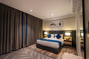 Habitación Deluxe | Ropa de cama de alta calidad, minibar y insonorización 