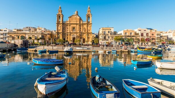 A harbor with boats, a prominent church with two towers, and surrounding buildings. - Fairytale - Maltese Balcony - Separate Living Room (Valletta)