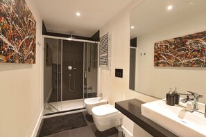 Shower, jetted tub, hair dryer, bidet