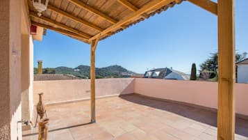 Enjoy the serene views of the surrounding landscape from this outdoor terrace.