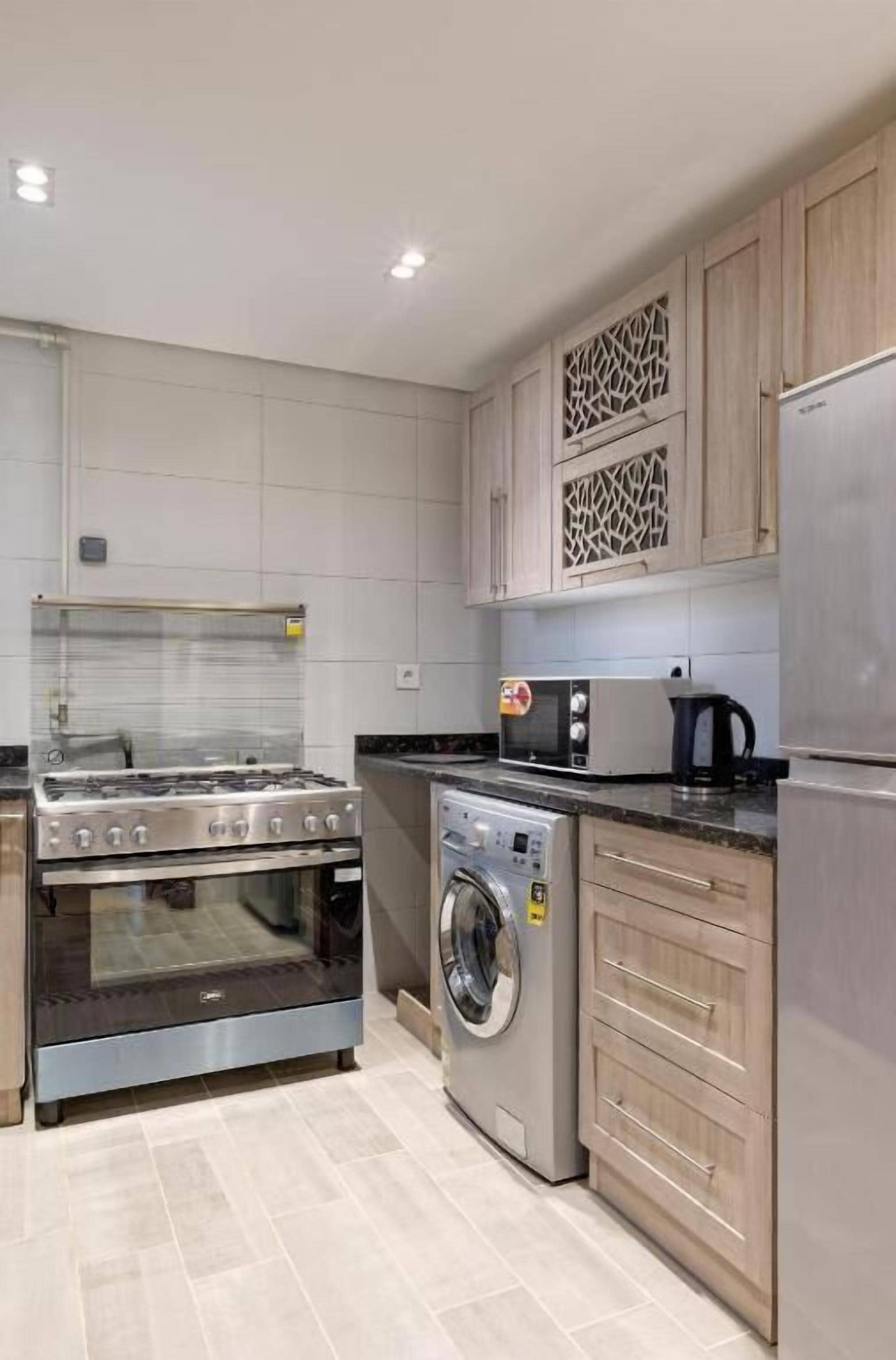 Deluxe Apartment, 2 Bedrooms, City View | Private kitchen | Full-size fridge, oven, stovetop, cookware/dishes/utensils