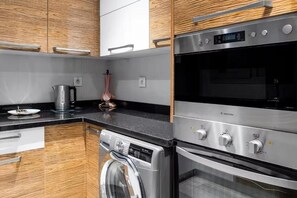 Classic Apartment, 2 Bedrooms, City View | Private kitchen | Full-size fridge, oven, stovetop, cookware/dishes/utensils
