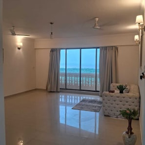 Executive Deluxe Room | Living area | 32-inch LCD TV with cable channels