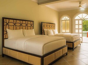 Deluxe Quadruple Room | Premium bedding, in-room safe, desk, laptop workspace