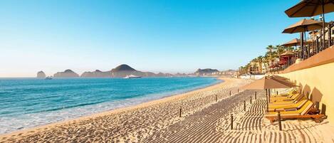 On the beach, sun loungers, beach towels