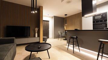 Apartment, 2 Bedrooms, Balcony | Living area | Flat-screen TV
