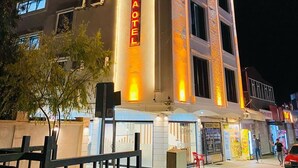 A multi-story hotel with a prominent 'DARA HOTEL' sign, large windows, and a modern architectural design. - Dara Otel Midyat (Midyat)