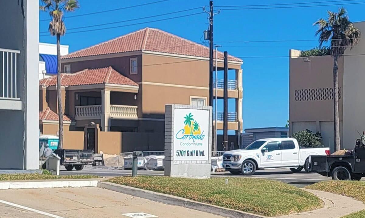A building with a sign for 'Coronado Condominiums' at 5701 Gulf Blvd.