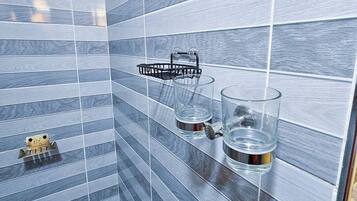 Shower, towels, soap, toilet paper