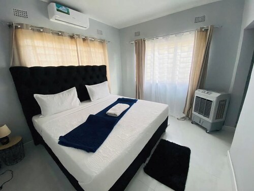 Cozy 2-Bedroom Apartment In Amazing Livingstone With AC, WiFi, 24/7 SOLAR BACKUP