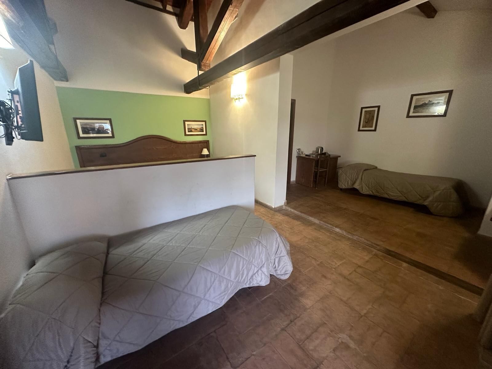 Quadruple Room, Patio, Courtyard View | Down comforters, minibar, in-room safe, desk