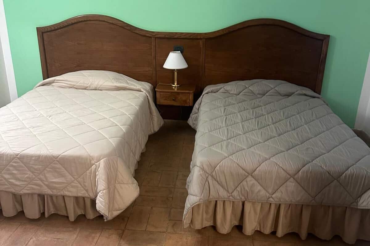 Twin Room, Patio, Sea View | Down comforters, minibar, in-room safe, desk