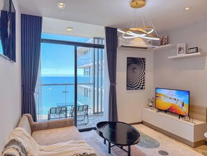 Apartment, 1 Bedroom, Ocean View | Living area | 70-cm flat-screen TV with cable channels