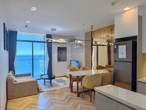 Apartment, 1 Bedroom, Ocean View | Living area | 70-cm flat-screen TV with cable channels
