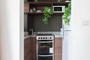 Comfort Apartment, Balcony, City View | Private kitchen | Full-size fridge, microwave, oven, stovetop - FLIPHAUS Gregoria Perez 3500 (Buenos Aires)