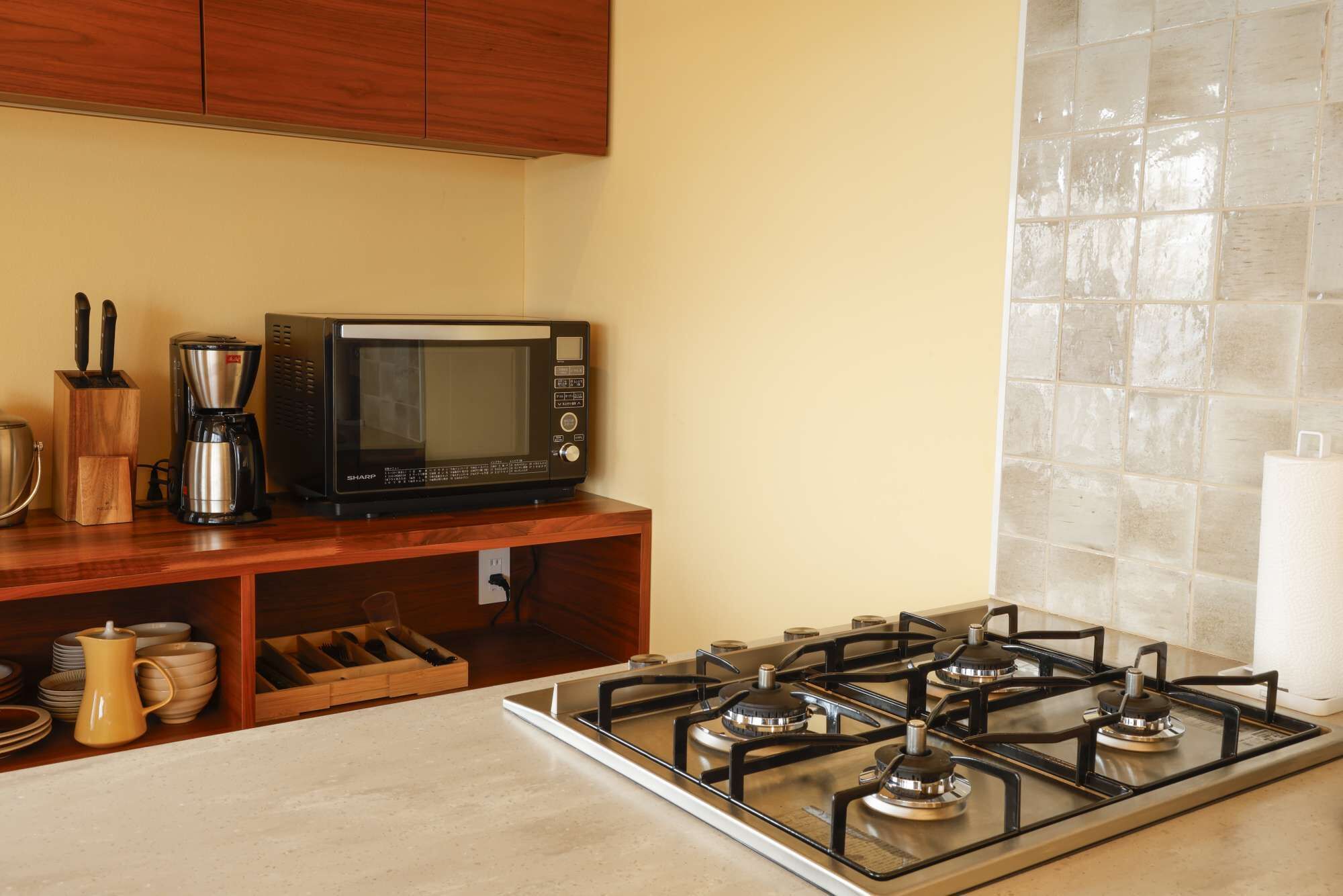 Fridge, microwave, stovetop, coffee/tea maker