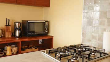 Fridge, microwave, stovetop, coffee/tea maker